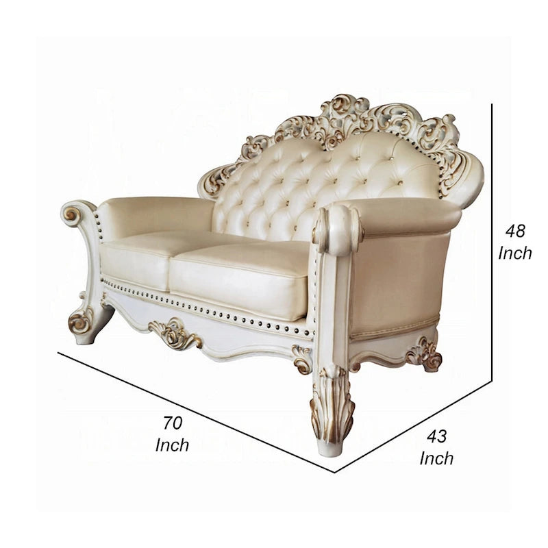 Causeuse traditionnelle capitonnée en similicuir couleur champagne avec 3 coussins pour 2 personnes